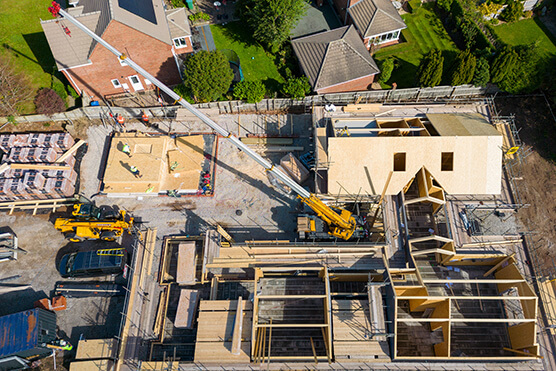 drone view of a crane lift at a construction site 