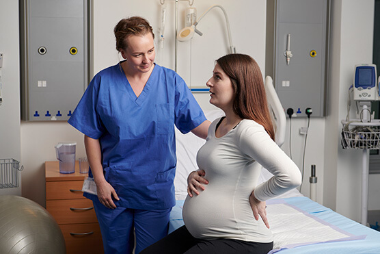 midwife and client on maternity ward photo